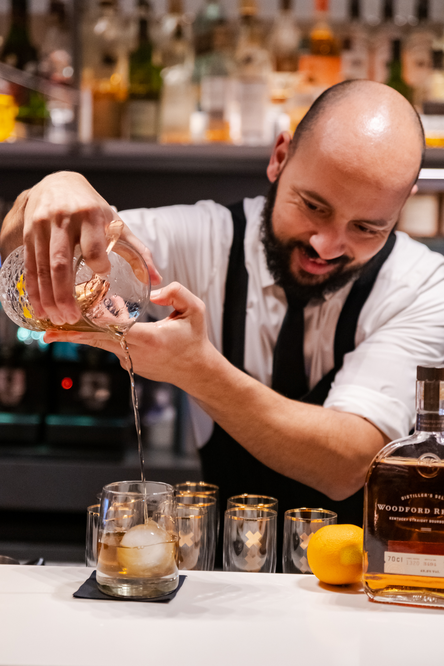 Bartender crafting a cocktail at the Library Bar of the Ambassade Hotel in Amsterdam