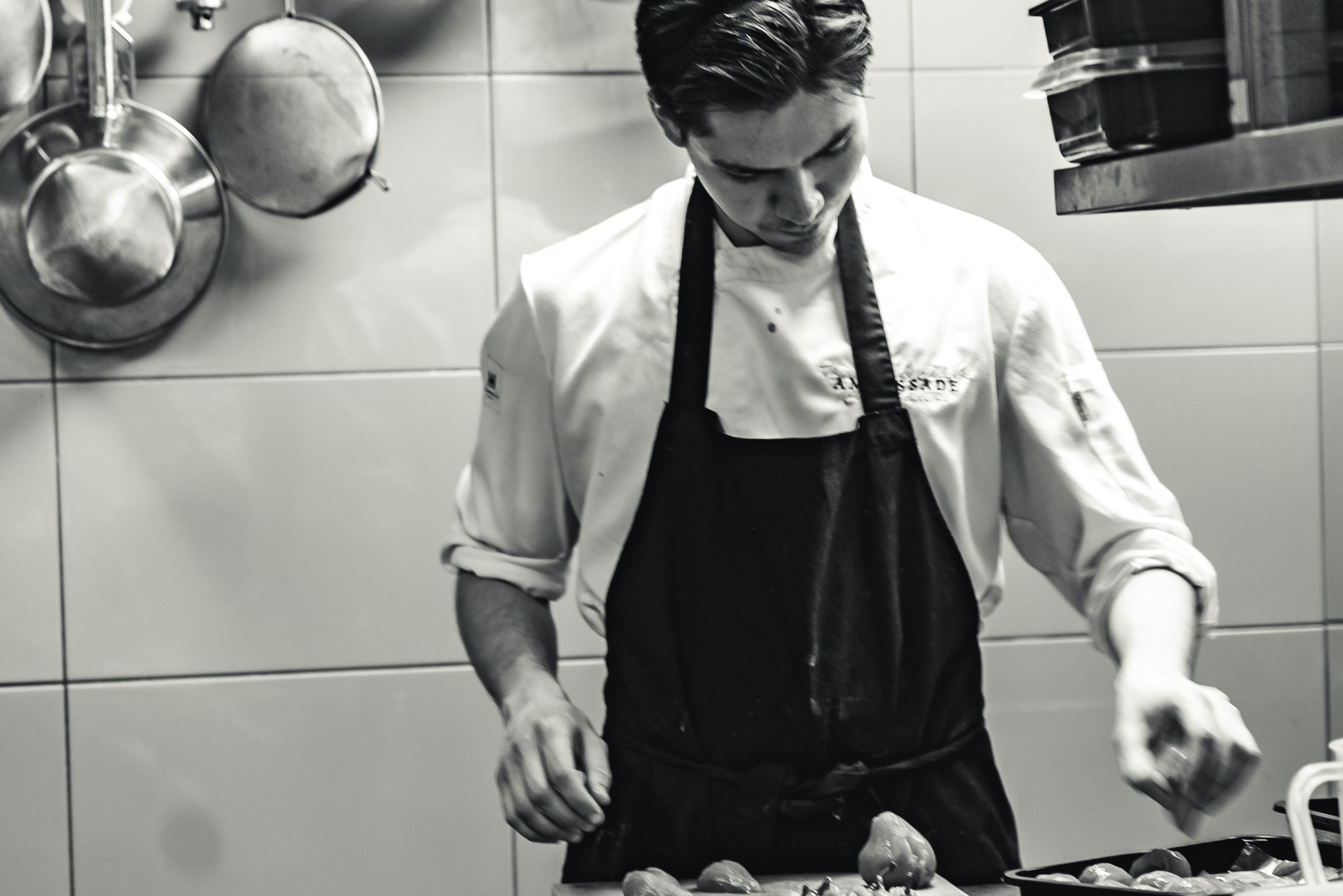 Chef cooking in the kitchen of Brasserie Ambassade in Amsterdam