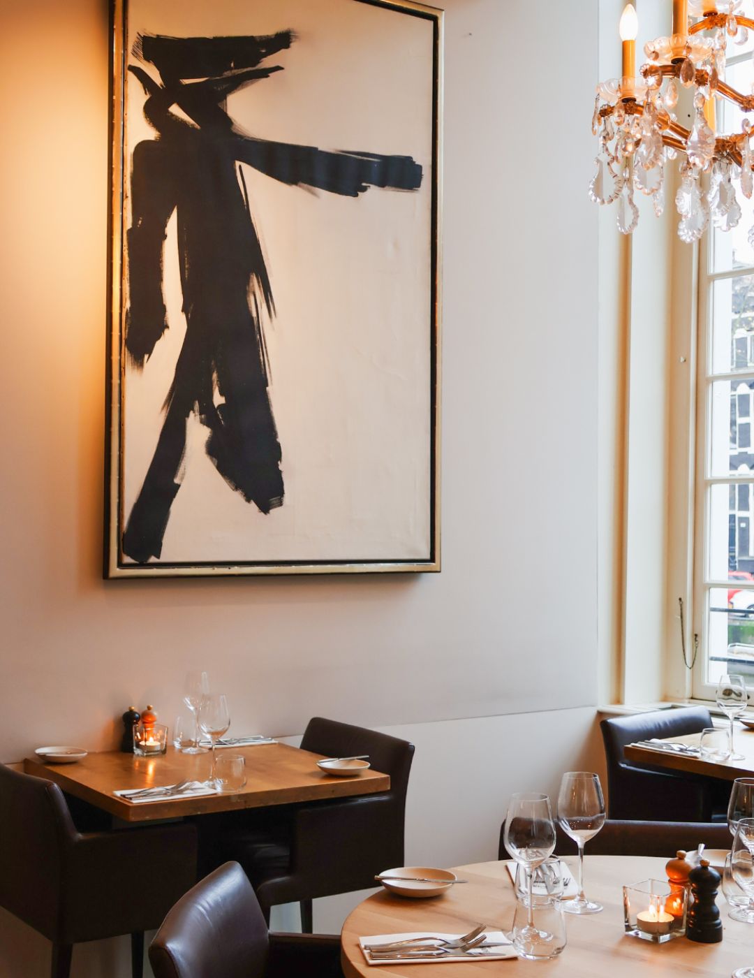 Art on display inside Brasserie Ambassade in Amsterdam